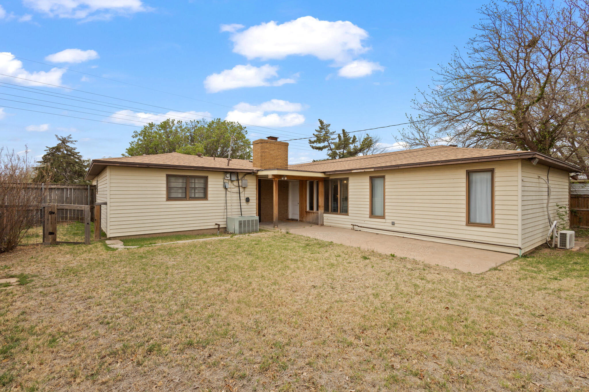 4302 42nd Street Lubbock, TX 79413 - Photo 60 of 67 a view of a house with a wooden fence
