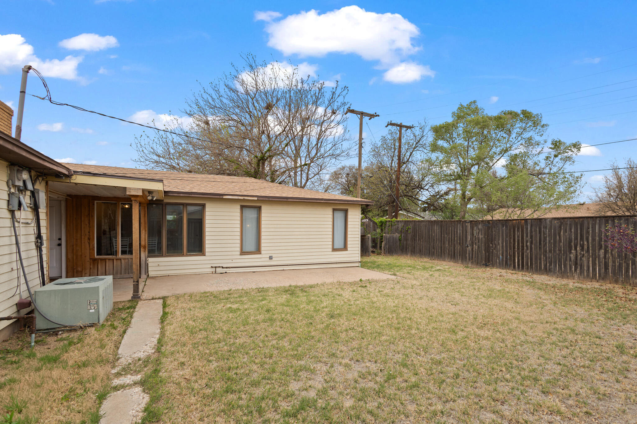 4302 42nd Street Lubbock, TX 79413 - Photo 61 of 67 a backyard of a house with table and chairs