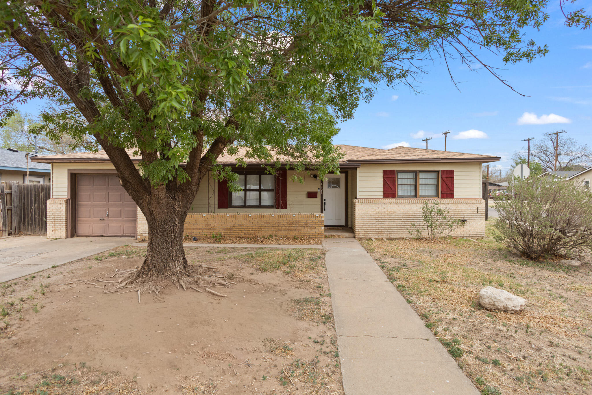 4302 42nd Street Lubbock, TX 79413 - Photo 67 of 67 front view of a house with a trees