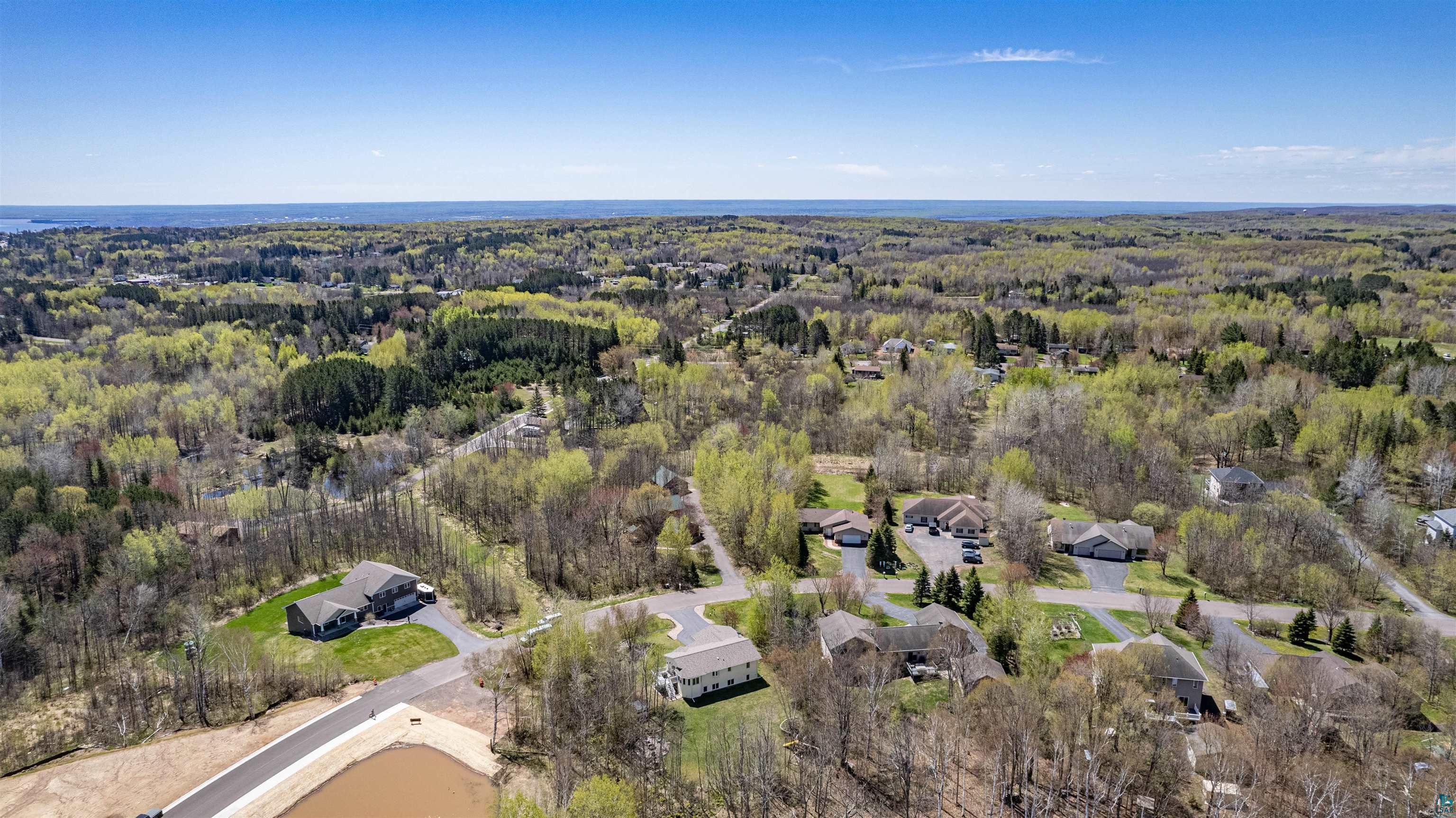 4809 Oak Ridge Drive Hermantown, MN 55811 - Photo 44 of 69 Aerial perspective showcasing a residential area surrounded by abundant mature trees and verdant foliage