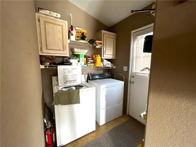 a living room with furniture gym equipment and a window