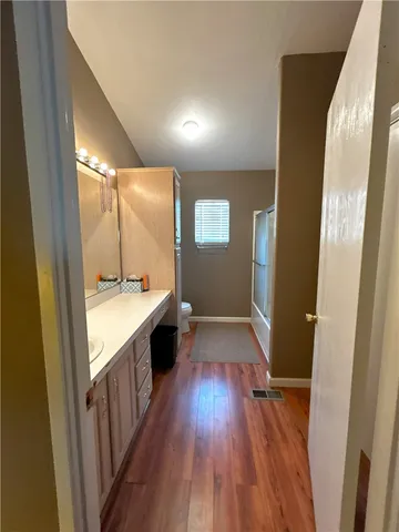 a bathroom with a sink and mirror