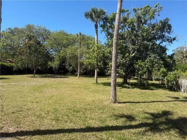 a view of lake with green space