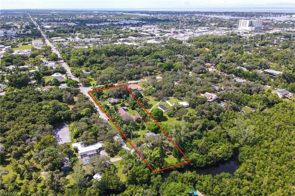 1063 Shadowlawn Drive Naples, FL 34104 - Photo 4 of 20 an aerial view of a city with lots of residential buildings