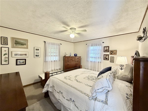 238 Trails End Road Blue Ridge, GA 30513 - Photo 14 of 32 a bed room with a bed and a chair