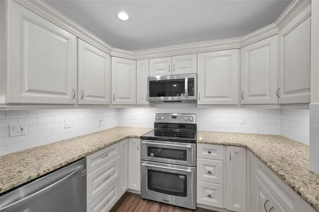 a view of a chair and table in the balcony