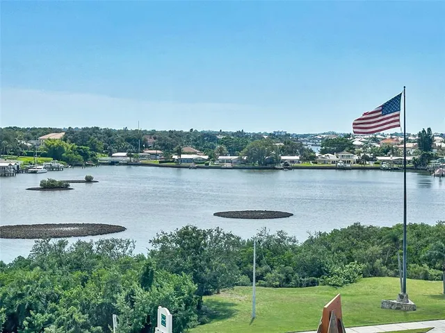a spacious bathroom with a tub sink and mirror