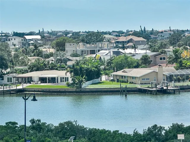 a sitting area with pier lake view and boat