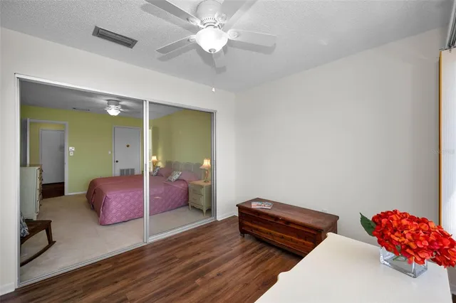 a view of a chair and tables in the park