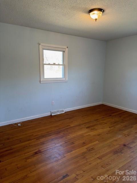 5376 Rhoney Road Connelly Springs, NC 28612 - Photo 15 of 21 a view of an empty room with wooden floor and a window