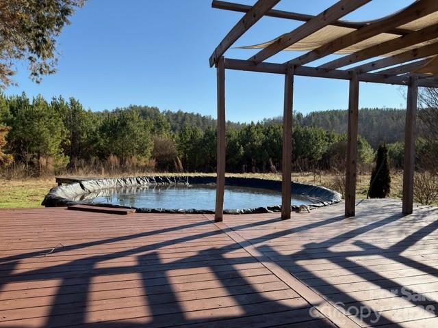 5376 Rhoney Road Connelly Springs, NC 28612 - Photo 2 of 21 a view of a swimming pool with a sitting space