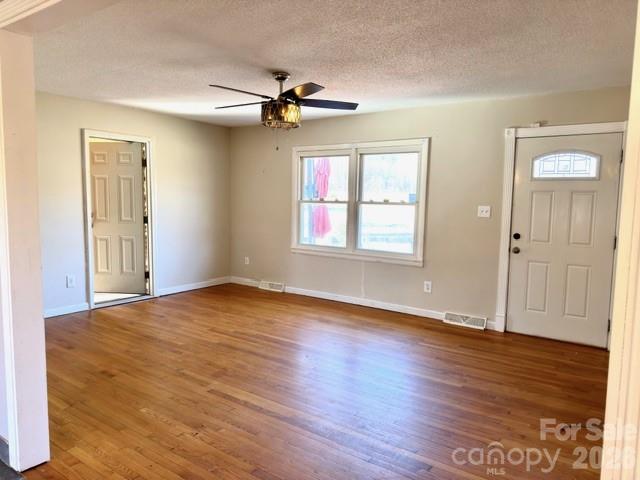 5376 Rhoney Road Connelly Springs, NC 28612 - Photo 3 of 21 a view of an empty room with wooden floor and a window