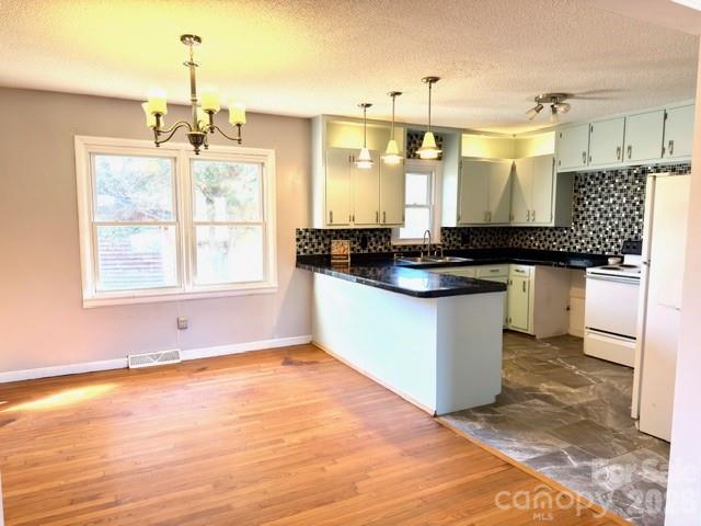 5376 Rhoney Road Connelly Springs, NC 28612 - Photo 4 of 21 a kitchen with granite countertop a sink and cabinets