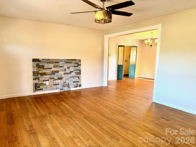 5376 Rhoney Road Connelly Springs, NC 28612 - Photo 7 of 21 a view of a hallway with wooden floor and a ceiling fan