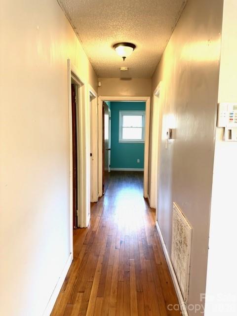 5376 Rhoney Road Connelly Springs, NC 28612 - Photo 8 of 21 a view of hallway with wooden floor