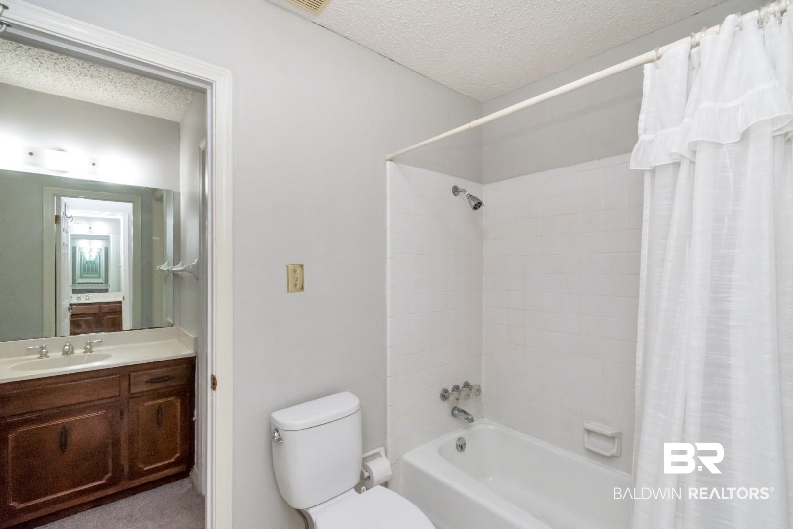 1229 West Chimney Top Drive Mobile, AL 36695 - Photo 21 of 36 Primary bath has separate his/her vanity areas. Each with it's own walk in closet. Tub/shower/toilet is in between. Great set up!