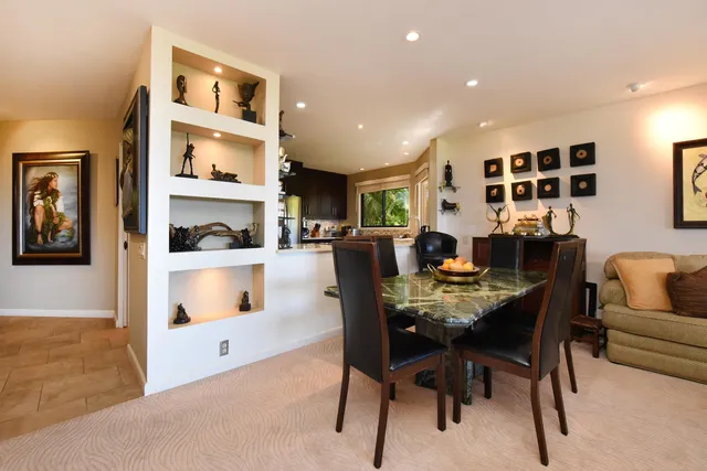 a kitchen with a stove microwave and sink