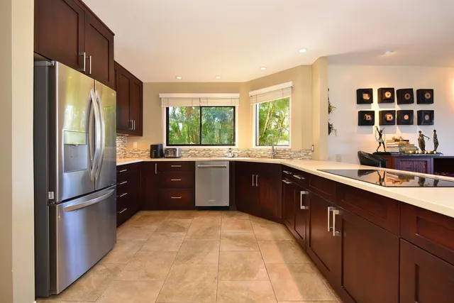 a kitchen with a sink and large window