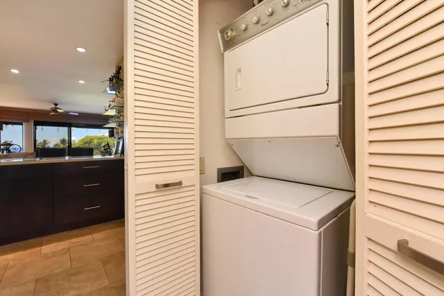 a bed room with a bed and a large window