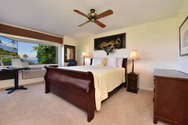 a bed room with a bed and a chandelier