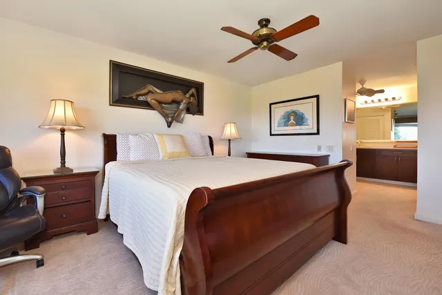 a bathroom with a sink vanity and mirror
