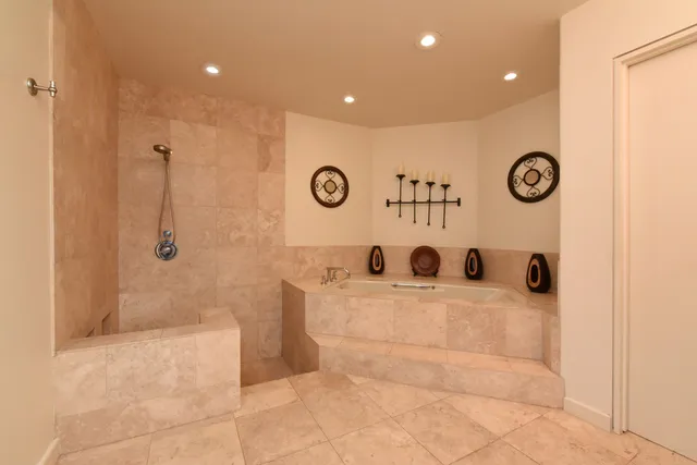 a bathroom with a tub and a sink