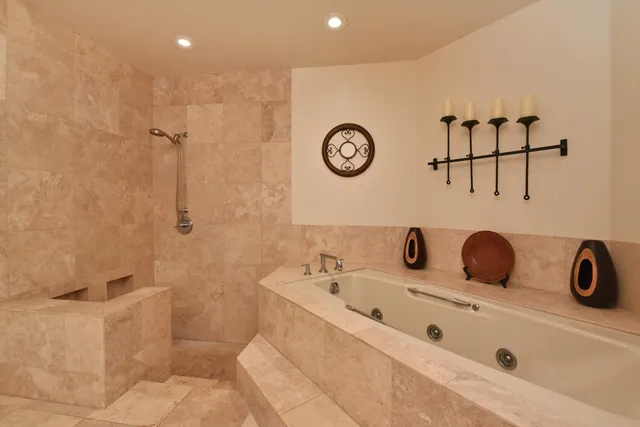 a view of a hallway with paintings on the wall