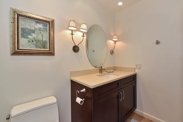 a bedroom with a bed and a flat tv screen