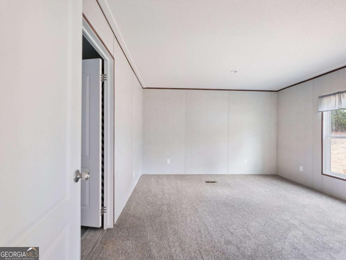 5224 Bogus Road Gainesville, GA 30506 - Photo 13 of 43 a view of an empty room with a window