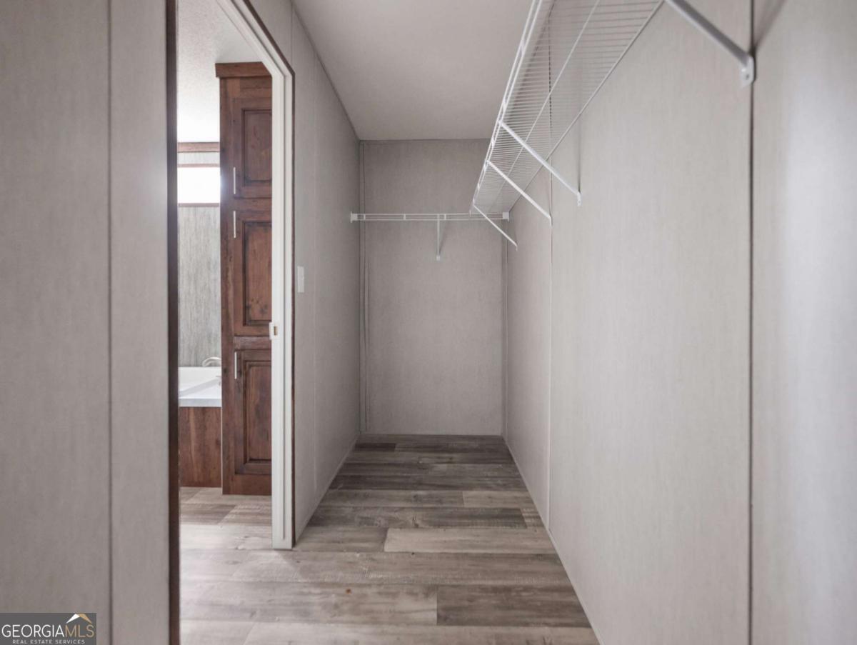 5224 Bogus Road Gainesville, GA 30506 - Photo 19 of 43 a view of hallway with wooden floor