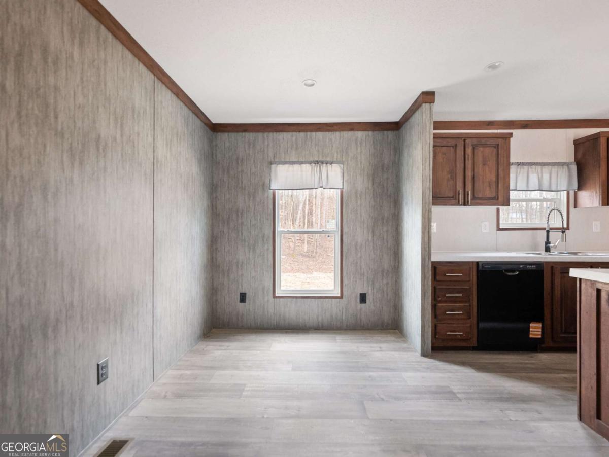 5224 Bogus Road Gainesville, GA 30506 - Photo 20 of 43 a view of an empty room with a fireplace and a window