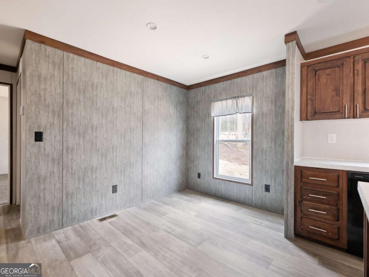5224 Bogus Road Gainesville, GA 30506 - Photo 21 of 43 a view of an empty room with a window and a kitchen