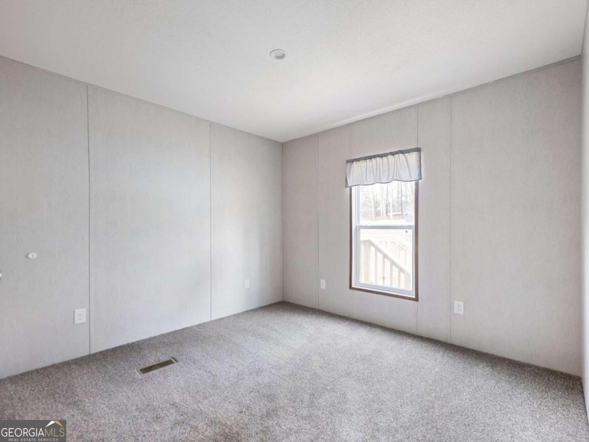 5224 Bogus Road Gainesville, GA 30506 - Photo 23 of 43 a view of a window in an empty room