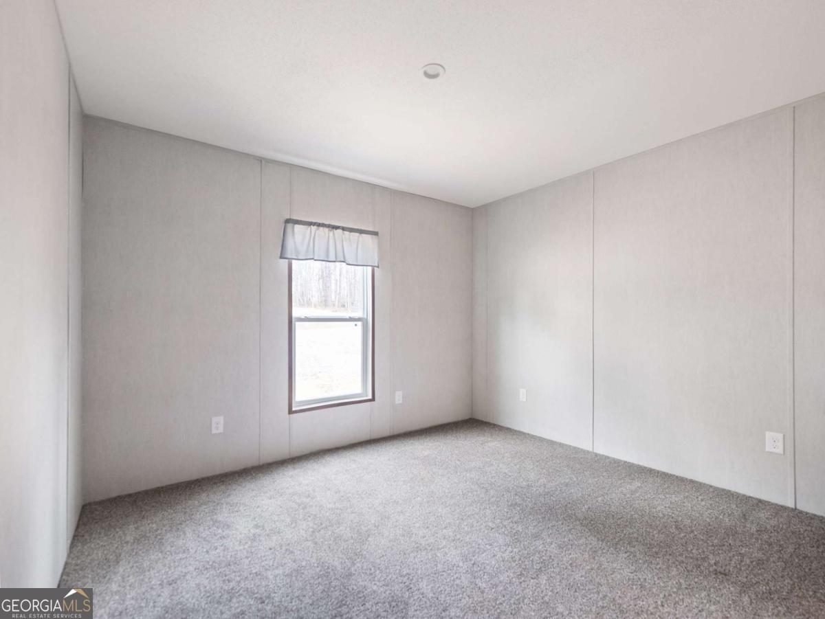5224 Bogus Road Gainesville, GA 30506 - Photo 26 of 43 a view of an empty room with a window