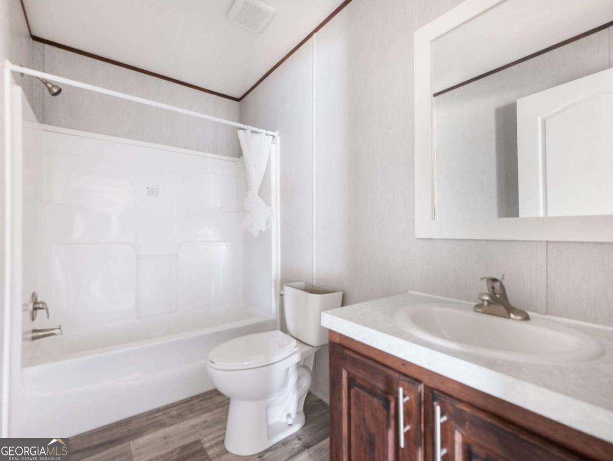 5224 Bogus Road Gainesville, GA 30506 - Photo 30 of 43 a bathroom with a sink toilet and shower