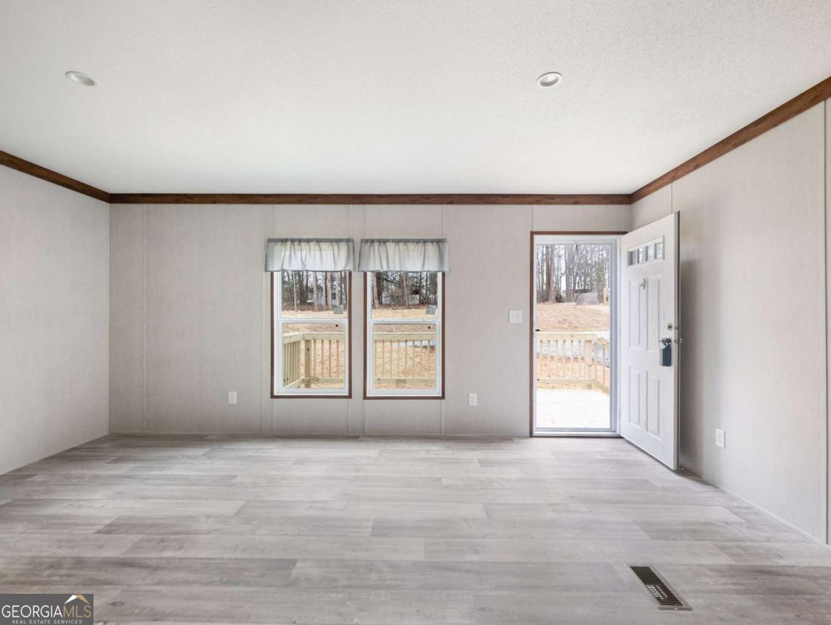 5224 Bogus Road Gainesville, GA 30506 - Photo 3 of 43 a view of an empty room with a window