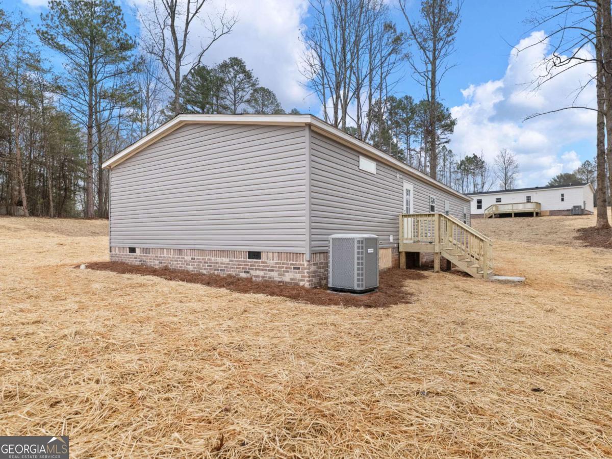 5224 Bogus Road Gainesville, GA 30506 - Photo 37 of 43 a view of a house with a yard