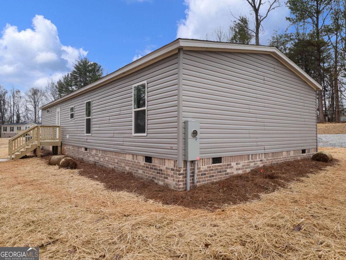 5224 Bogus Road Gainesville, GA 30506 - Photo 42 of 43 a view of a house with a yard