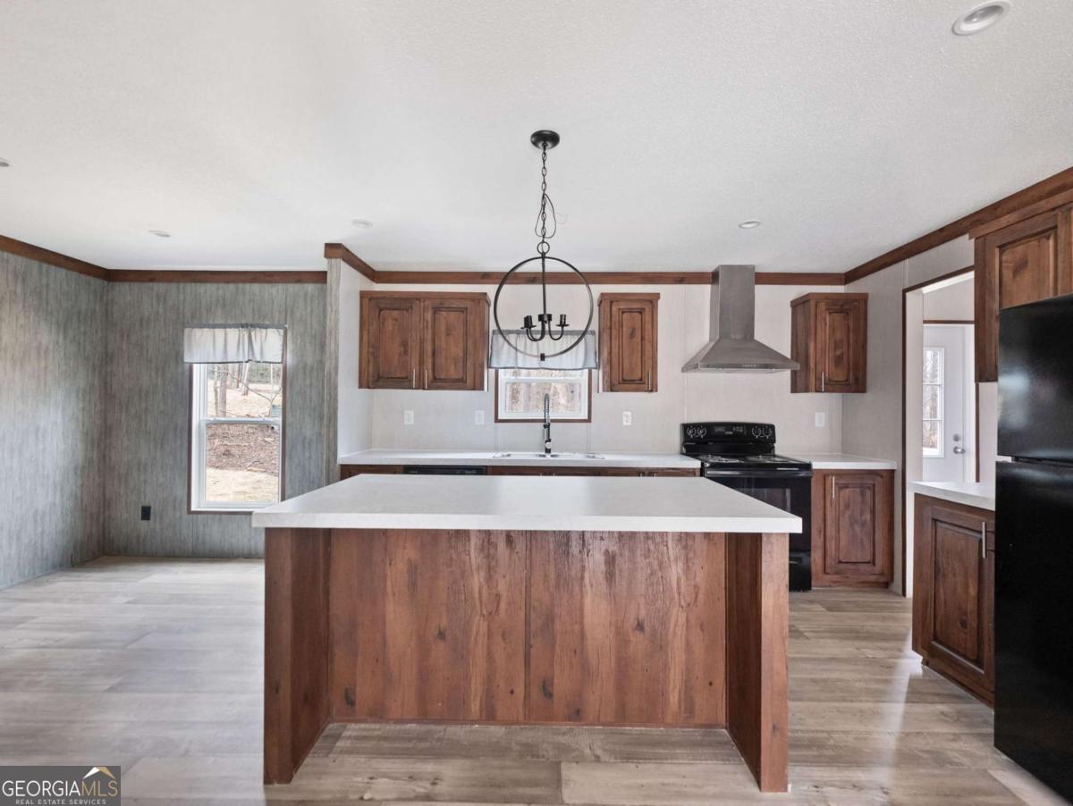 5224 Bogus Road Gainesville, GA 30506 - Photo 6 of 43 a room with kitchen island a counter top space stainless steel appliances and a window