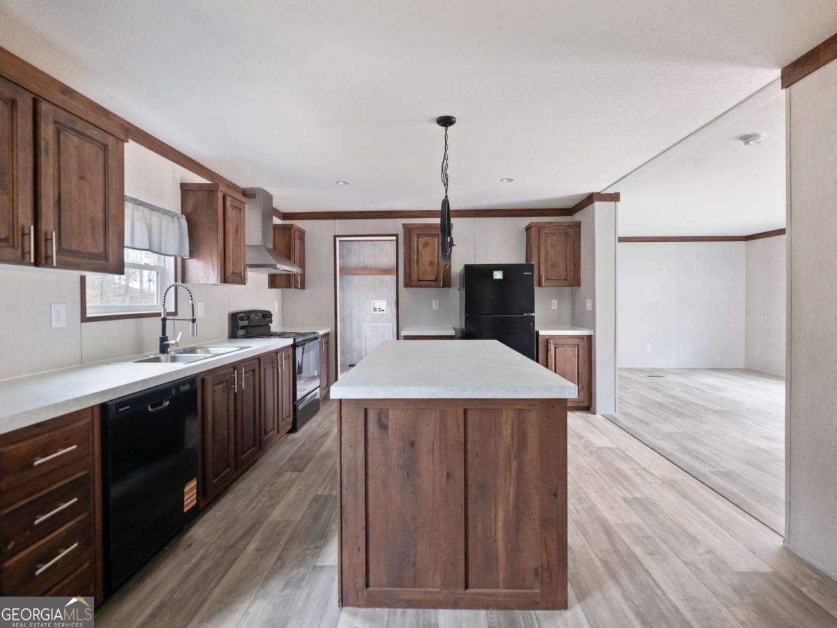 5224 Bogus Road Gainesville, GA 30506 - Photo 7 of 43 a kitchen with a stove a refrigerator and a sink