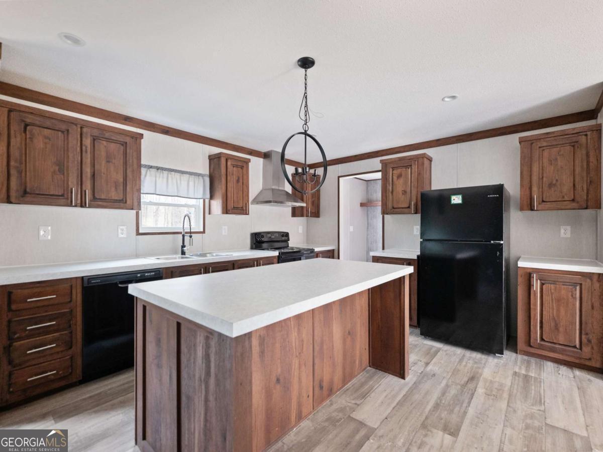 5224 Bogus Road Gainesville, GA 30506 - Photo 8 of 43 a kitchen that has a sink stainless steel appliances a counter top space and cabinets