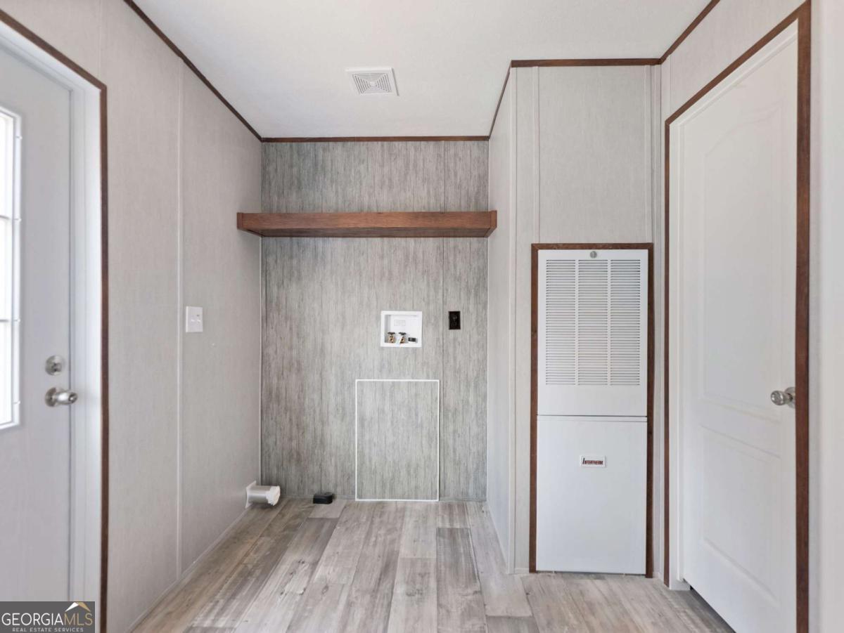 5224 Bogus Road Gainesville, GA 30506 - Photo 10 of 43 a view of a hallway with wooden floor and closet