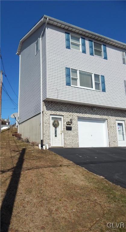 a view of a house with a street