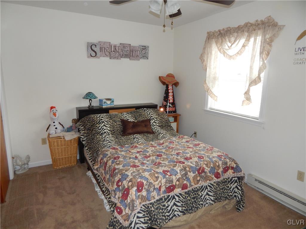 326 Chestnut Street Slatington, PA 18080 - Photo 12 of 14 a bed sitting in a bedroom next to a window