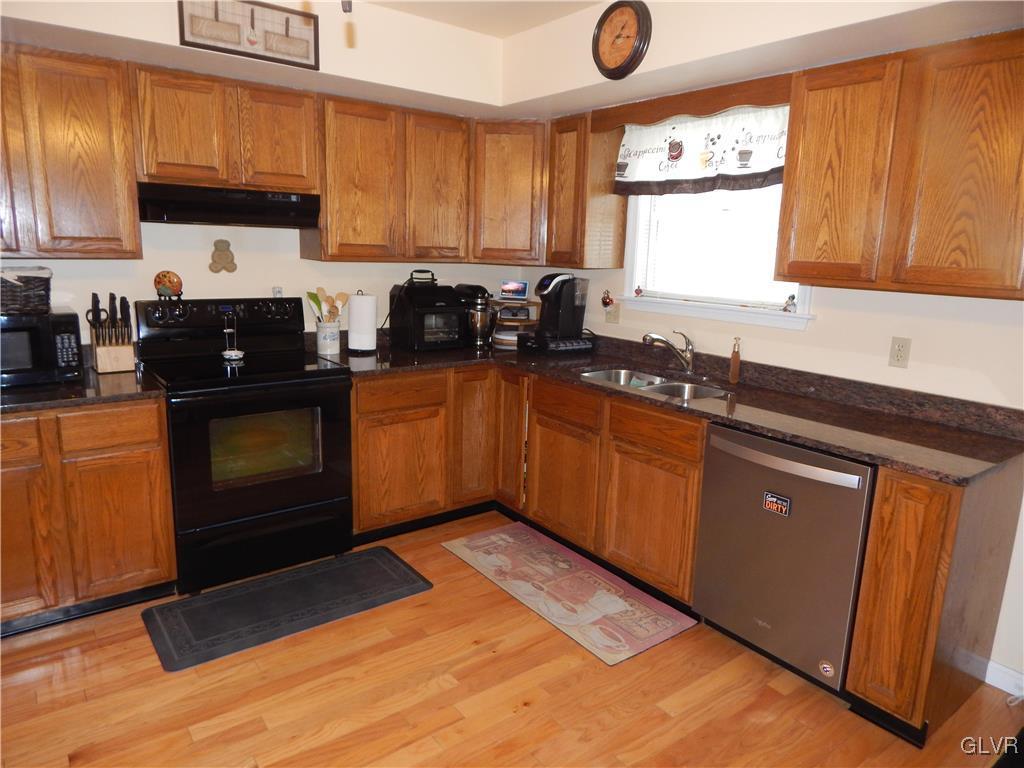 326 Chestnut Street Slatington, PA 18080 - Photo 5 of 14 a kitchen with stainless steel appliances granite countertop a sink stove and cabinets