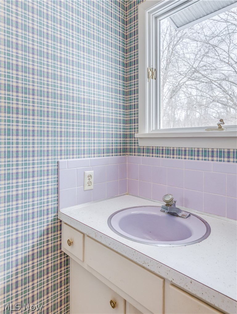 2481 Raber Road Uniontown, OH 44685 - Photo 24 of 33 Half Bath on the main level of the home off the hallway adjacent to the Kitchen