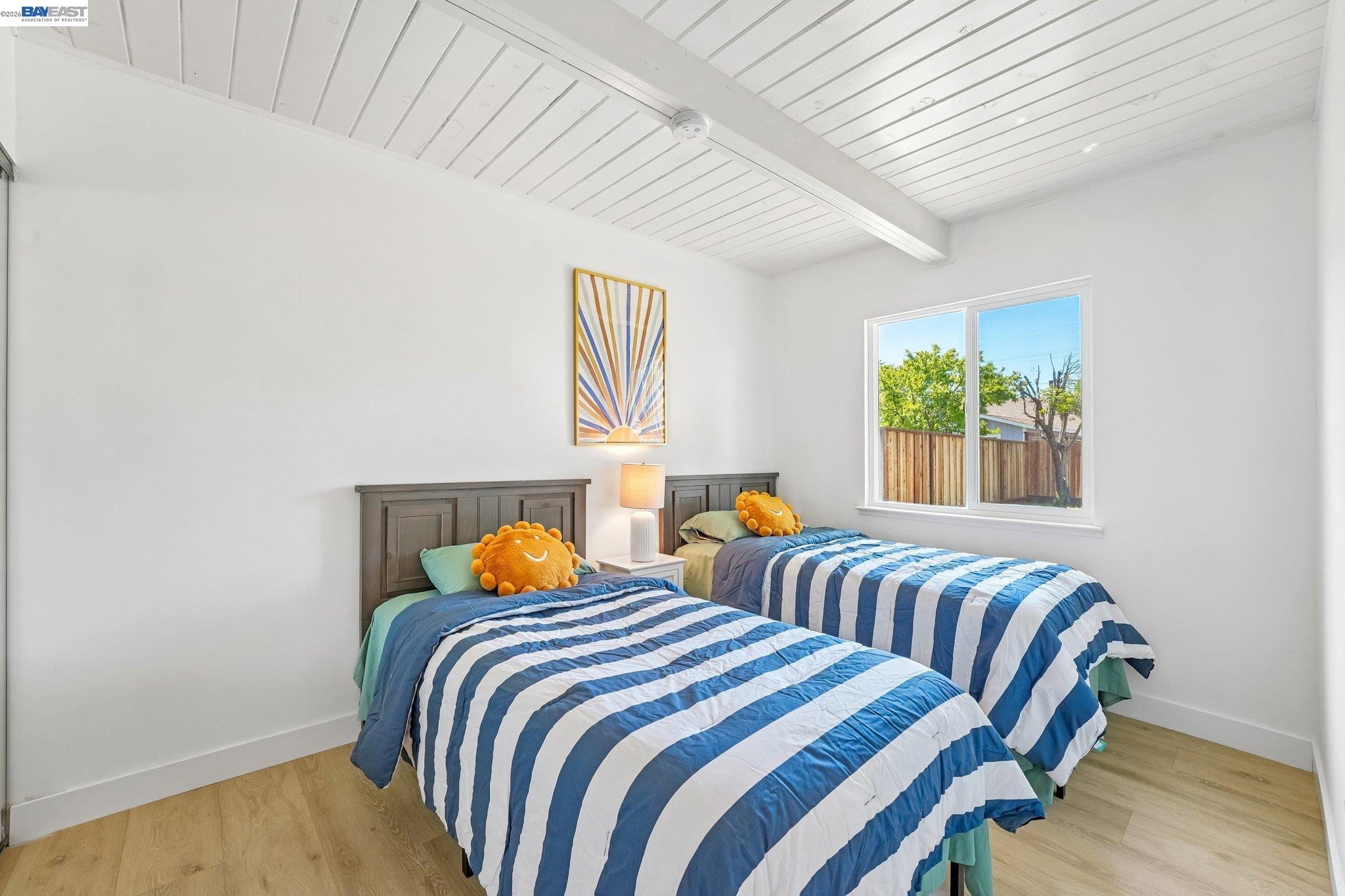 606 West 9th Street Santa Rosa, CA 95401 - Photo 33 of 52 a bedroom with two beds and a window