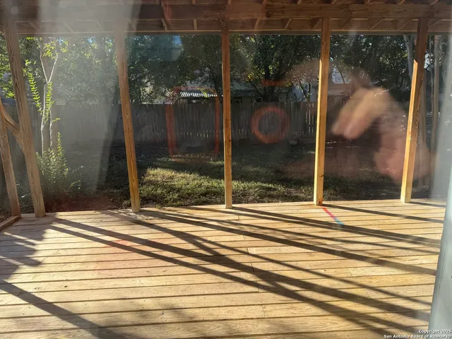 a view of a glass door of the house