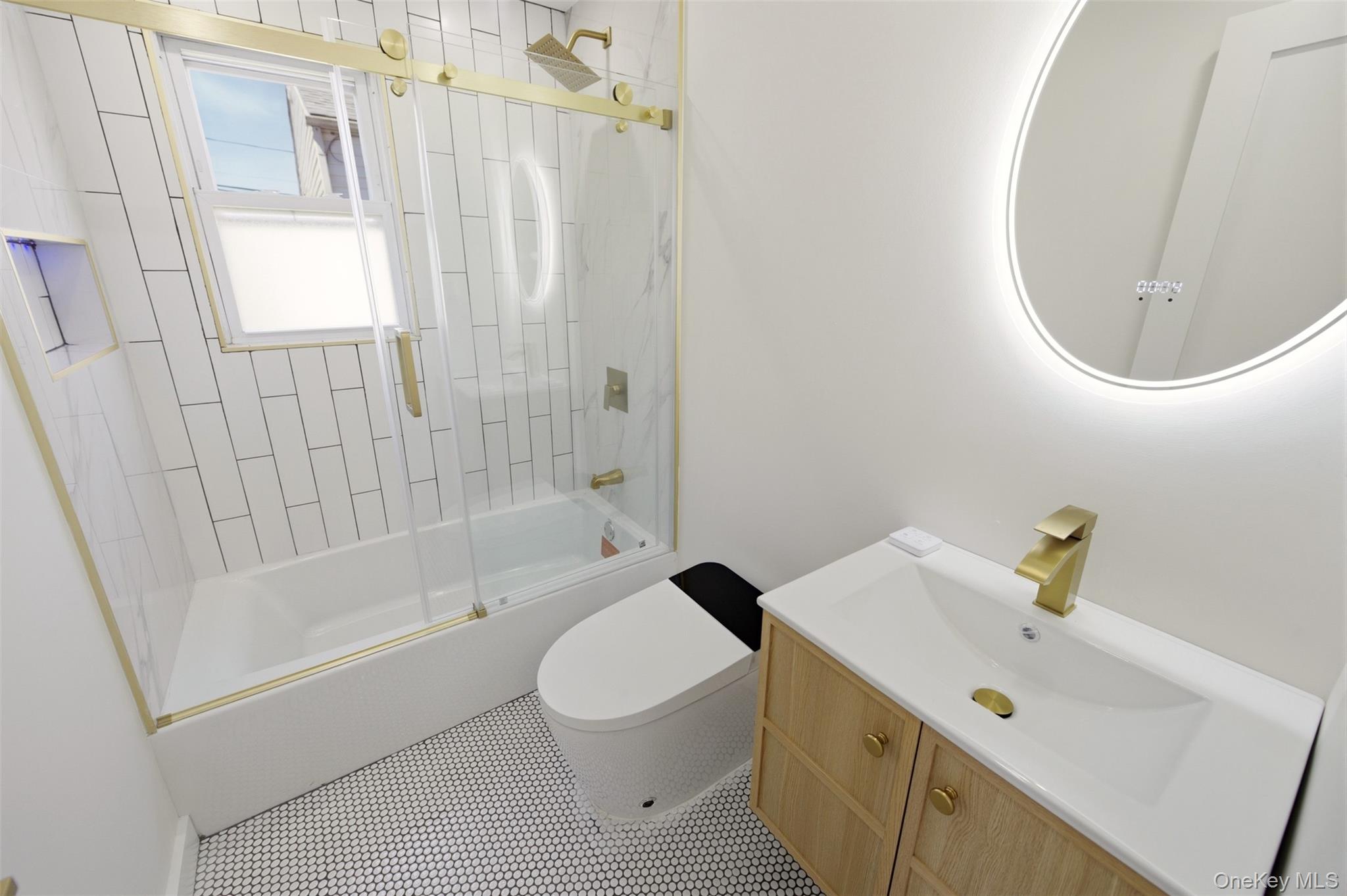 135 Whaley Street Freeport, NY 11520 - Photo 25 of 38 a bathroom with a sink a toilet and shower