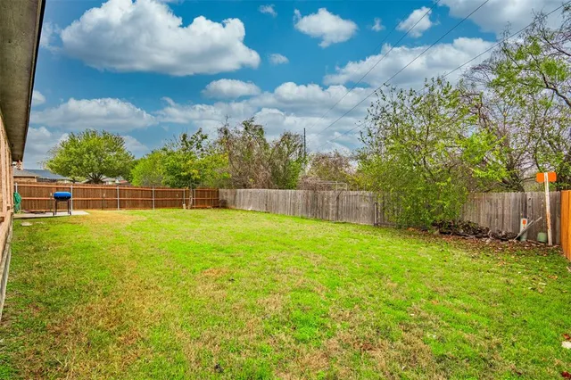 a view of outdoor space with deck and yard